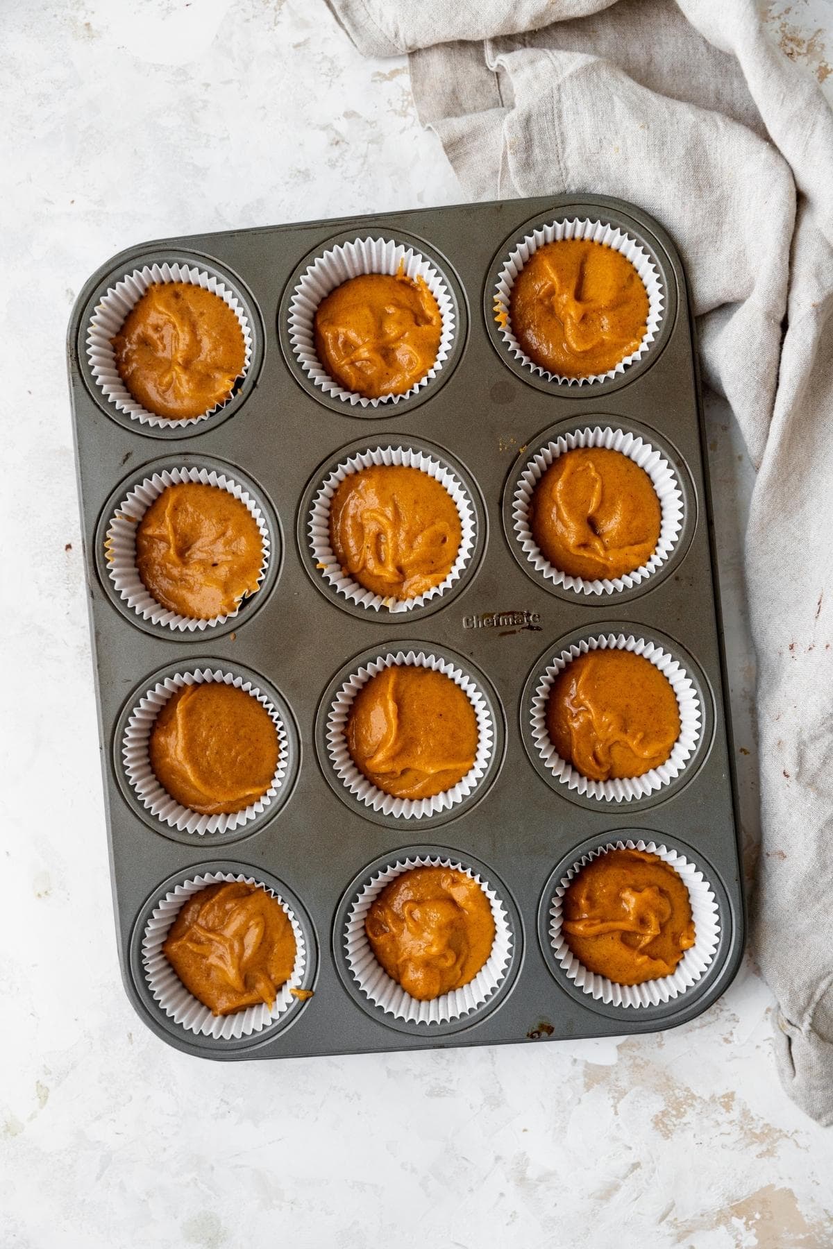 Pumpkin Cupcake batter unbaked in baking pan