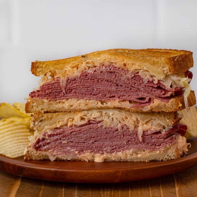 Reuben Sandwich on plate with chips