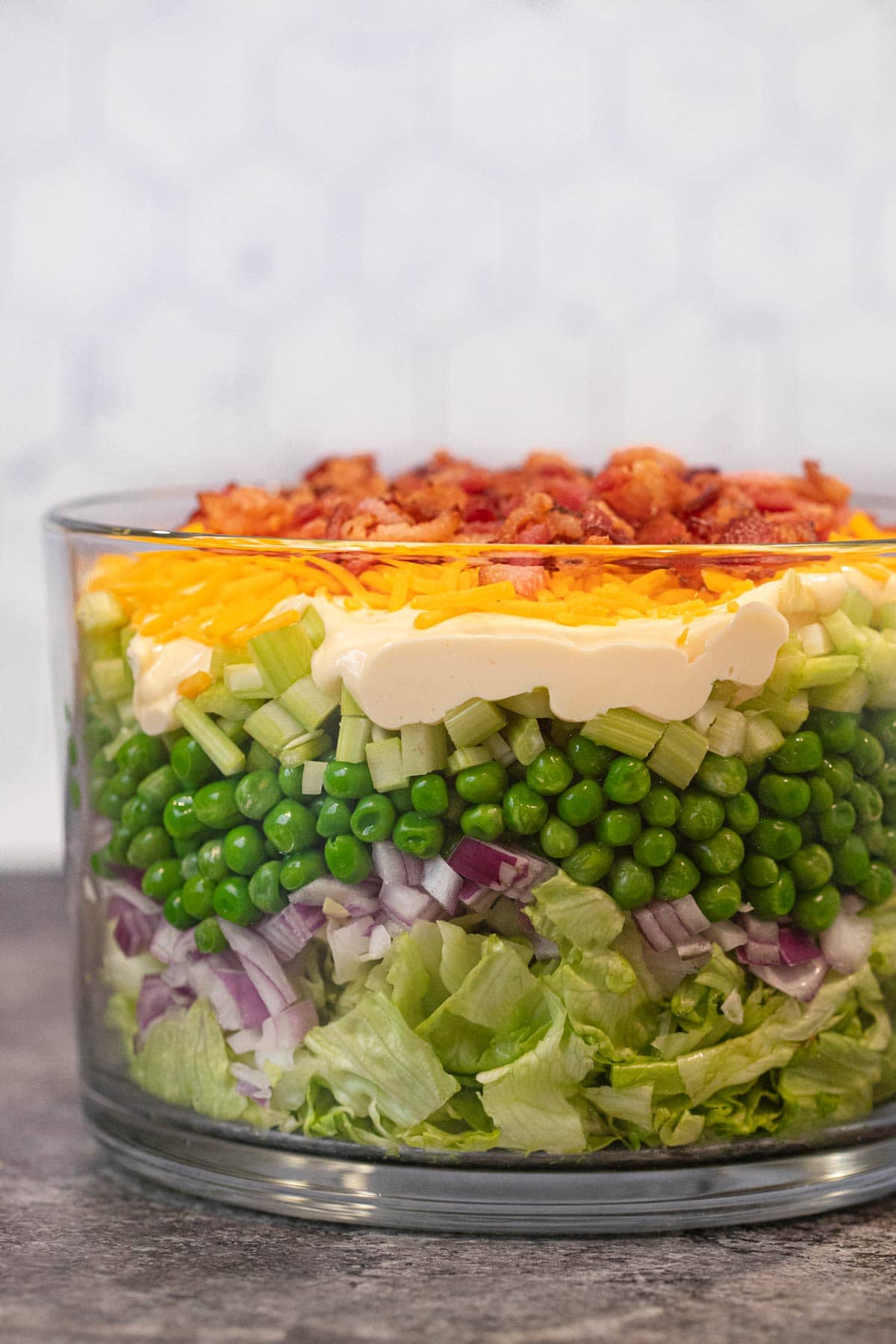 Seven Layer Salad side view in glass bowl