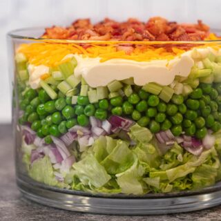 Seven Layer Salad side view in glass bowl