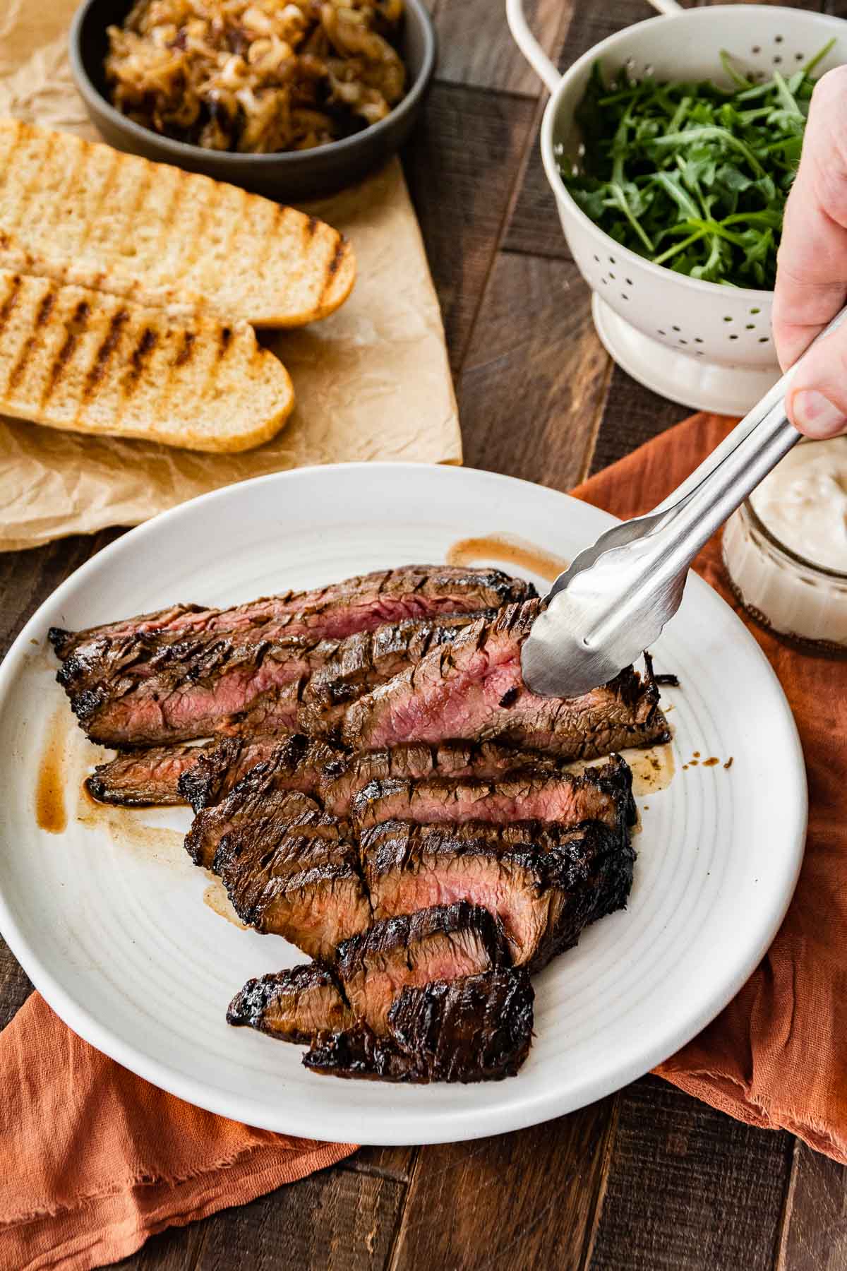 Sliced steak on plate for Steak Sandwiches