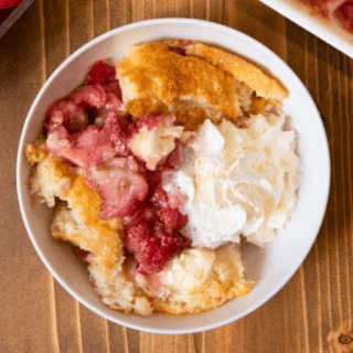 Bowl of cobbler with whipped topping