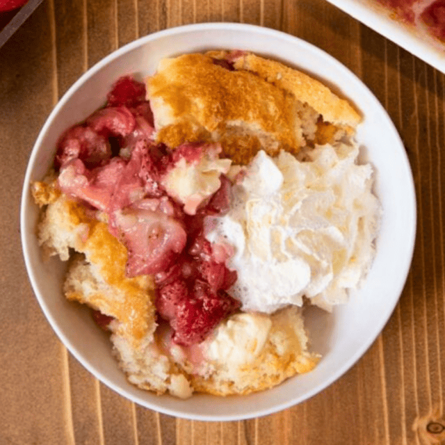 Bowl of cobbler with whipped topping