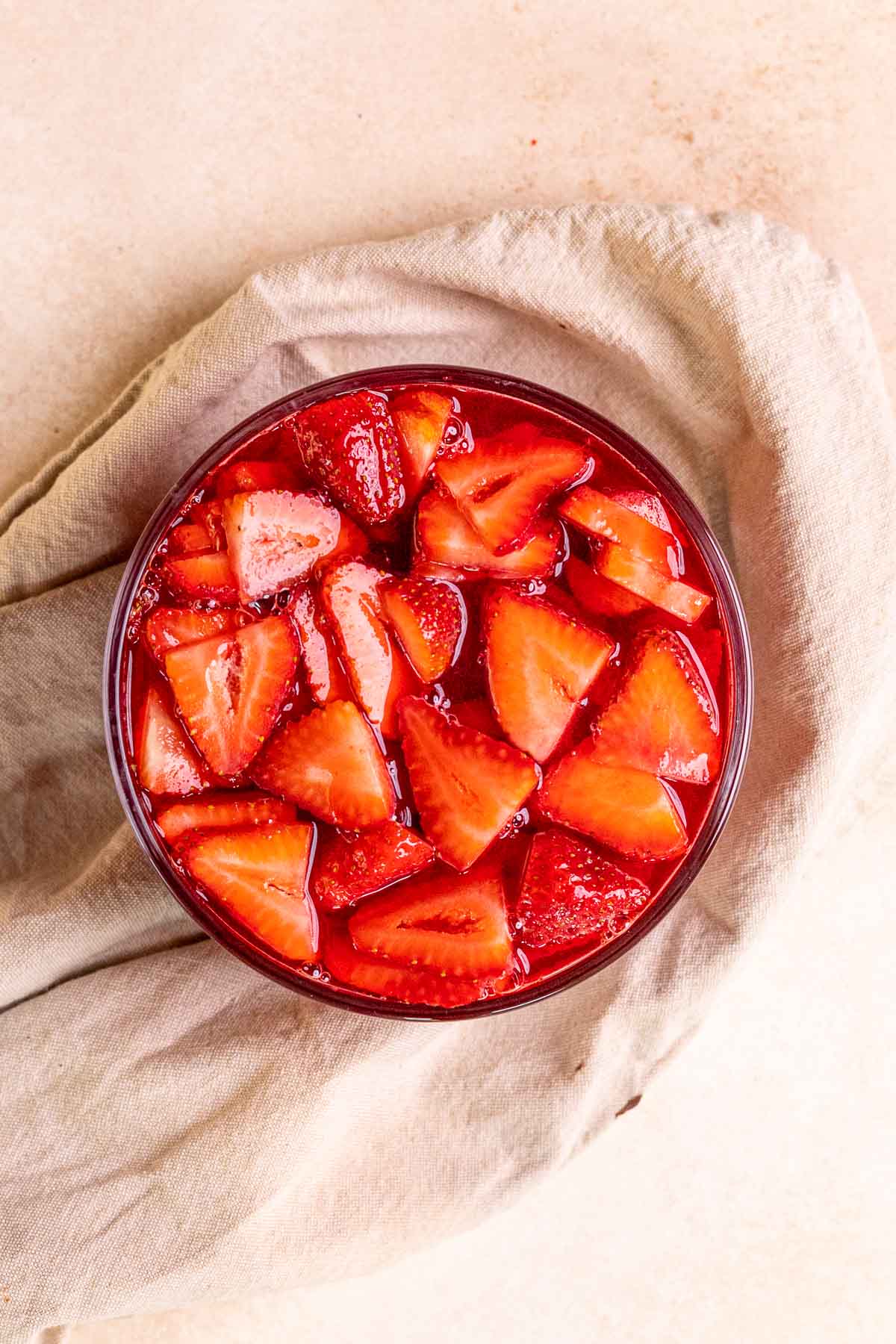 Strawberry Pretzel Salad strawberries in sauce in mixing bowl