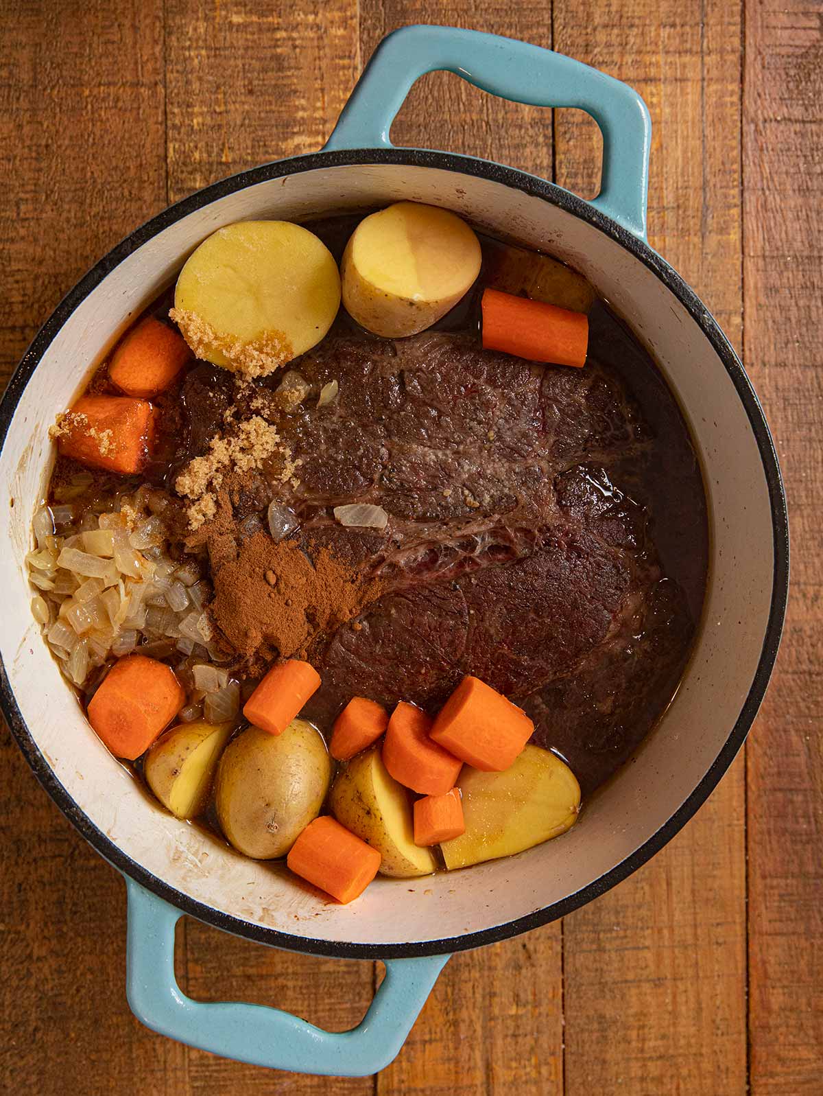 Swedish Pot Roast ingredients in pot with seared roast