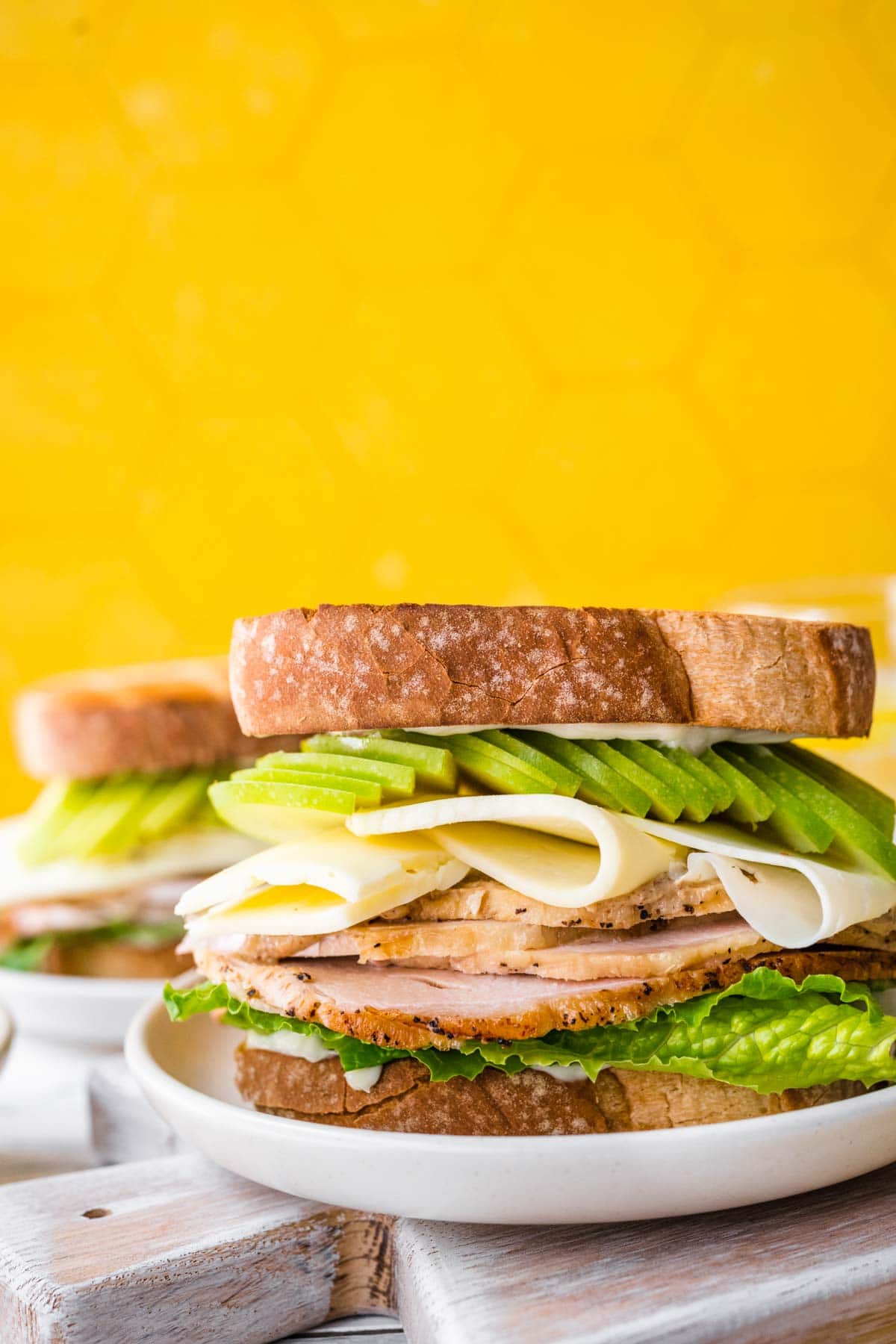 plate with a Turkey Havarti Apple Sandwich