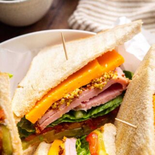 Ultimate Ham Sandwich sliced on serving plate 1x1