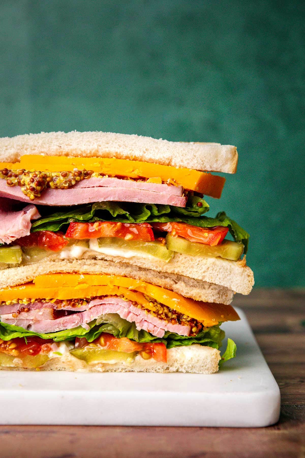 Ultimate Ham Sandwich stacked on cutting board
