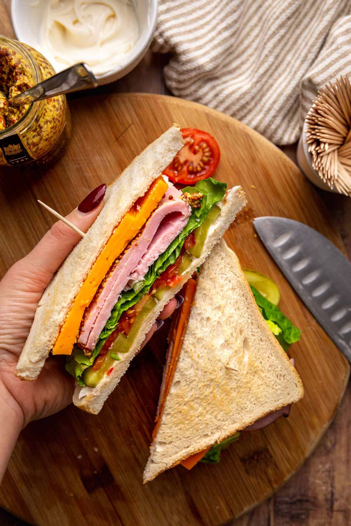 Ultimate Ham Sandwich sliced on cutting board