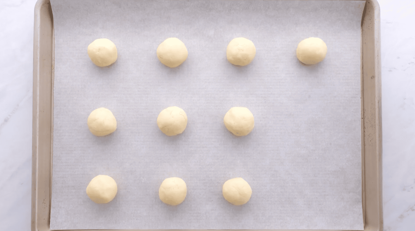 balls of cookie dough on baking sheet