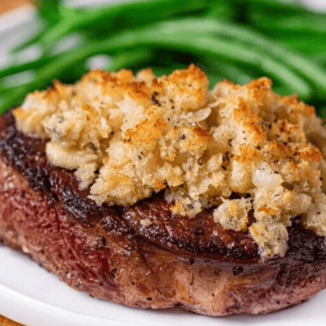 Filet served on plate with green beans