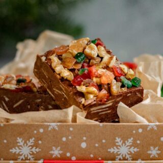 Christmas Fudge squares with nuts and candy in gift box