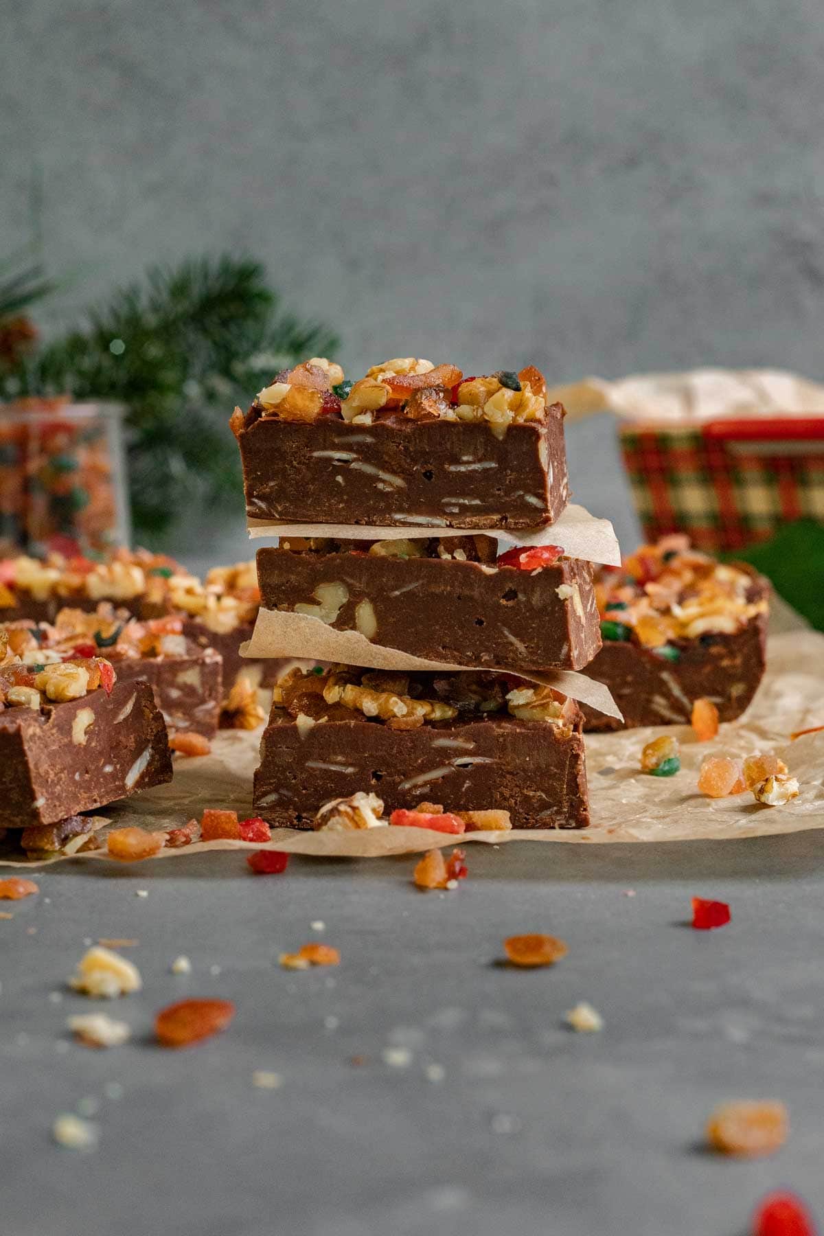 Christmas Fudge squares with nuts and candy on parchment