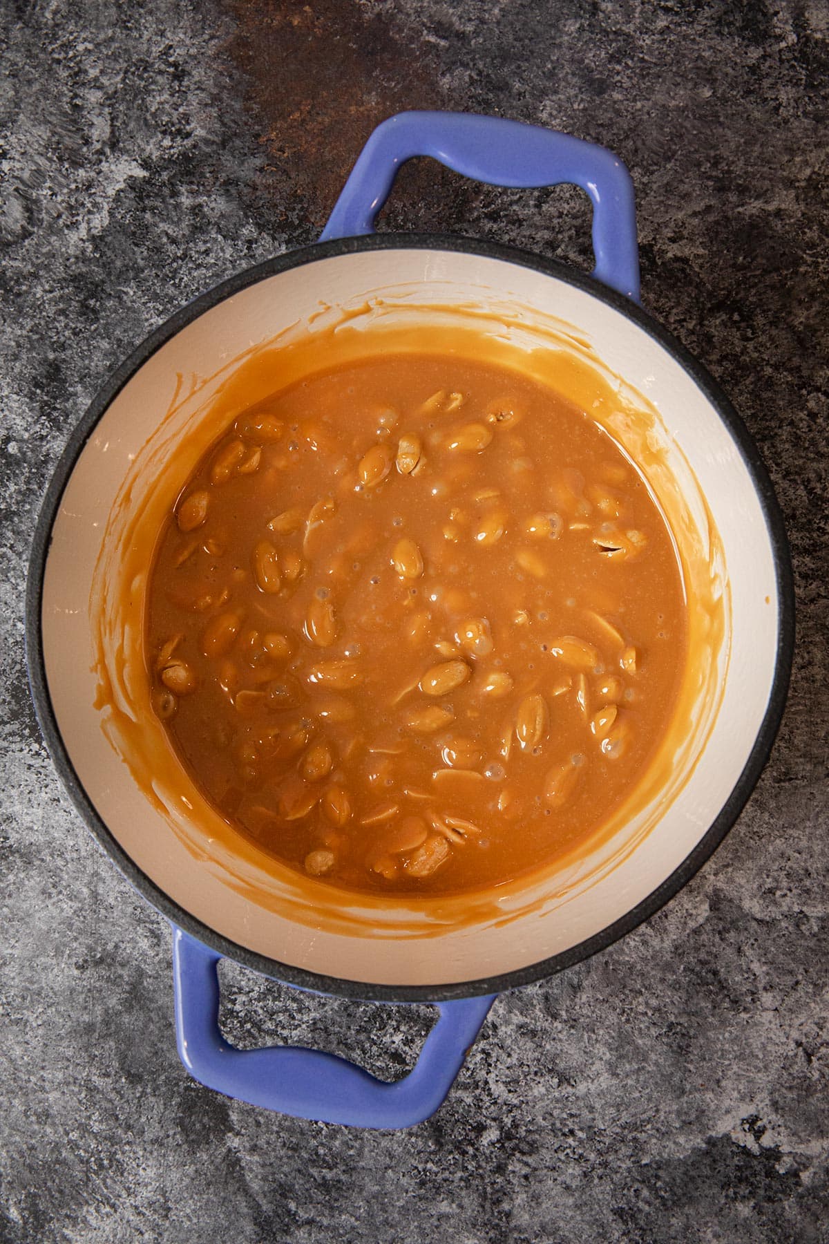 Caramel Peanut Clusters melted caramel and peanut in pot