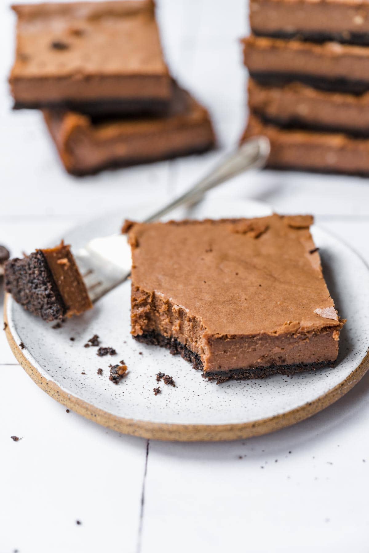 Chocolate Cheesecake Bars sliced on plate