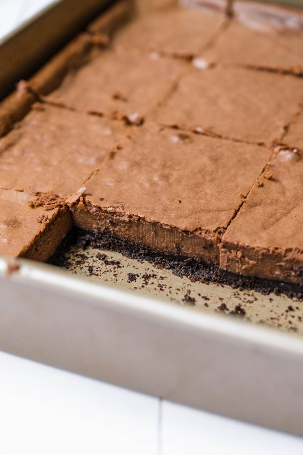 Chocolate Cheesecake Bars sliced in baking dish