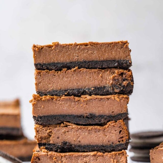 Chocolate Cheesecake Bars sliced and stacked
