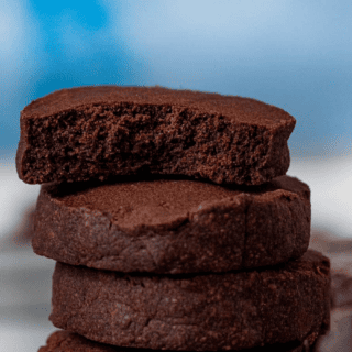 cookies stacked with top one with bite taken
