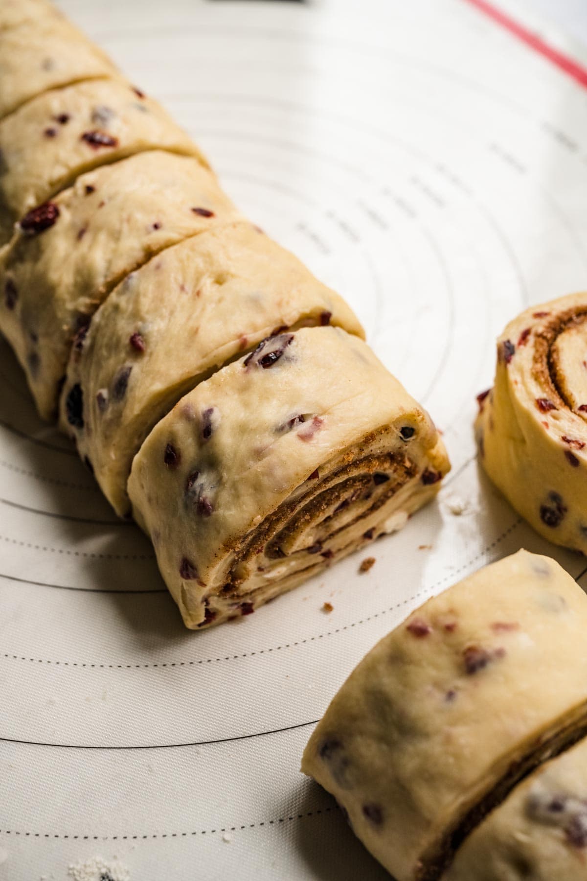 Cranberry White Chocolate Cinnamon Rolls dough rolled and cut