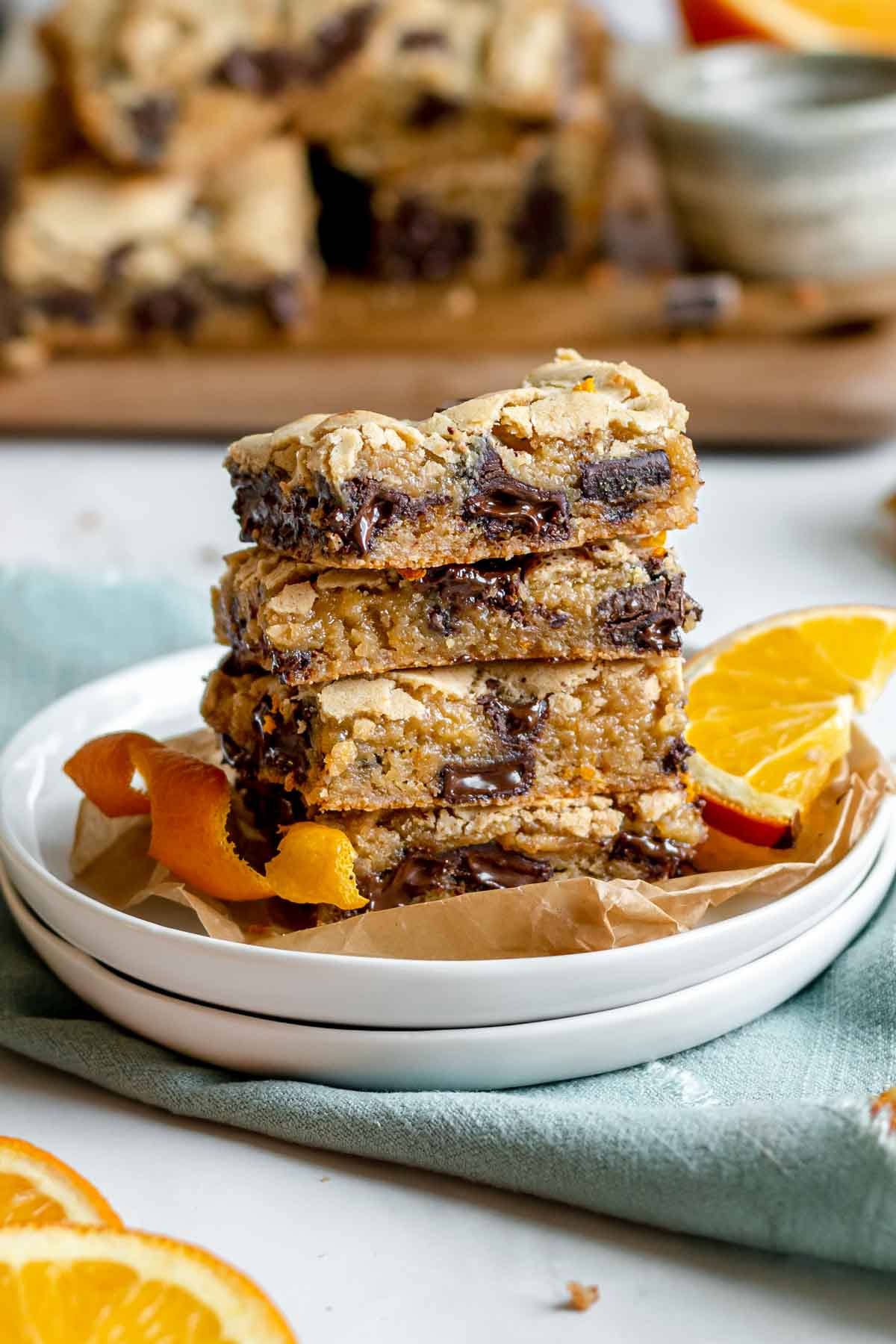 Dark Chocolate Orange Blondies stacked on serving plate