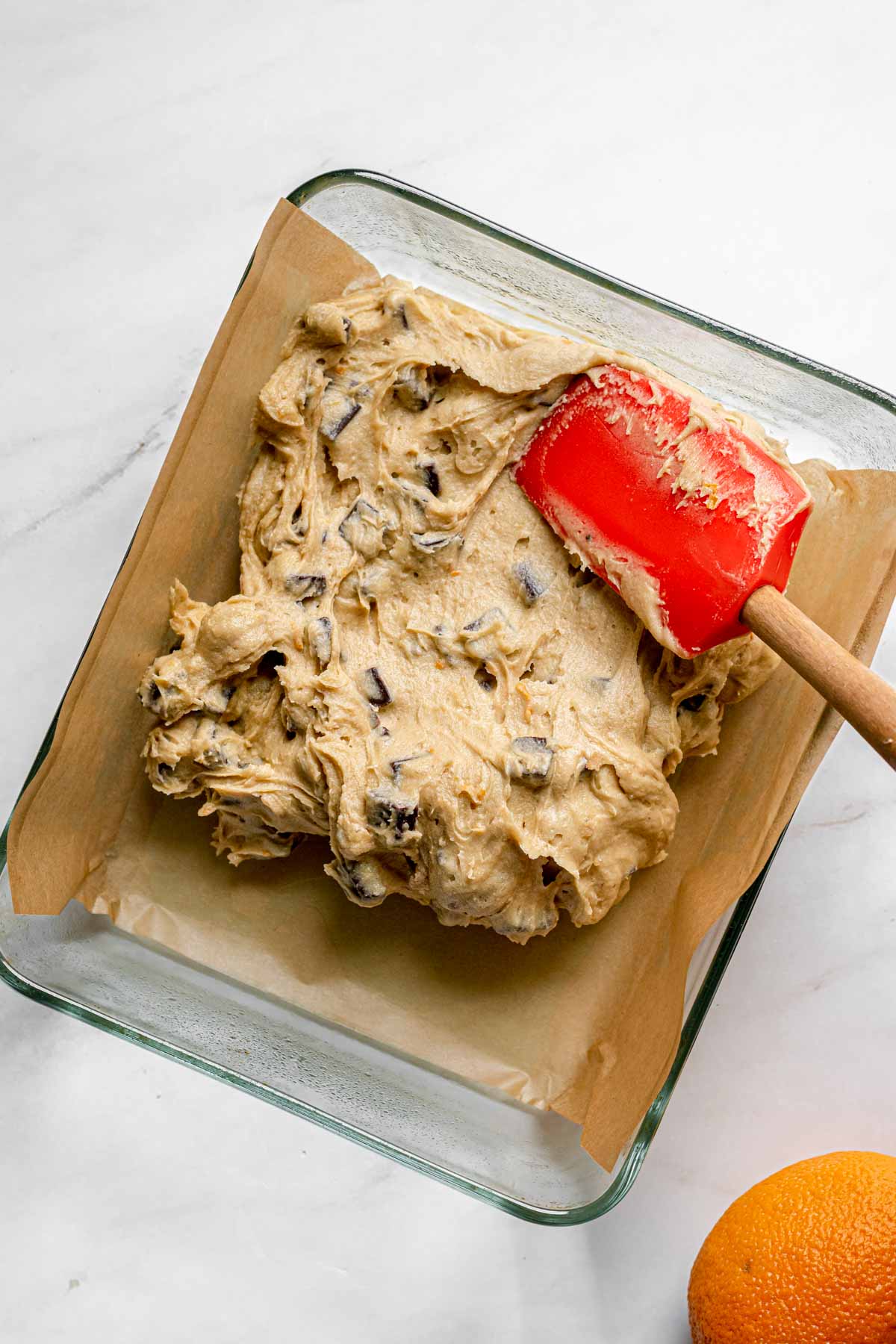 Dark Chocolate Orange Blondies spreading batter in baking pan