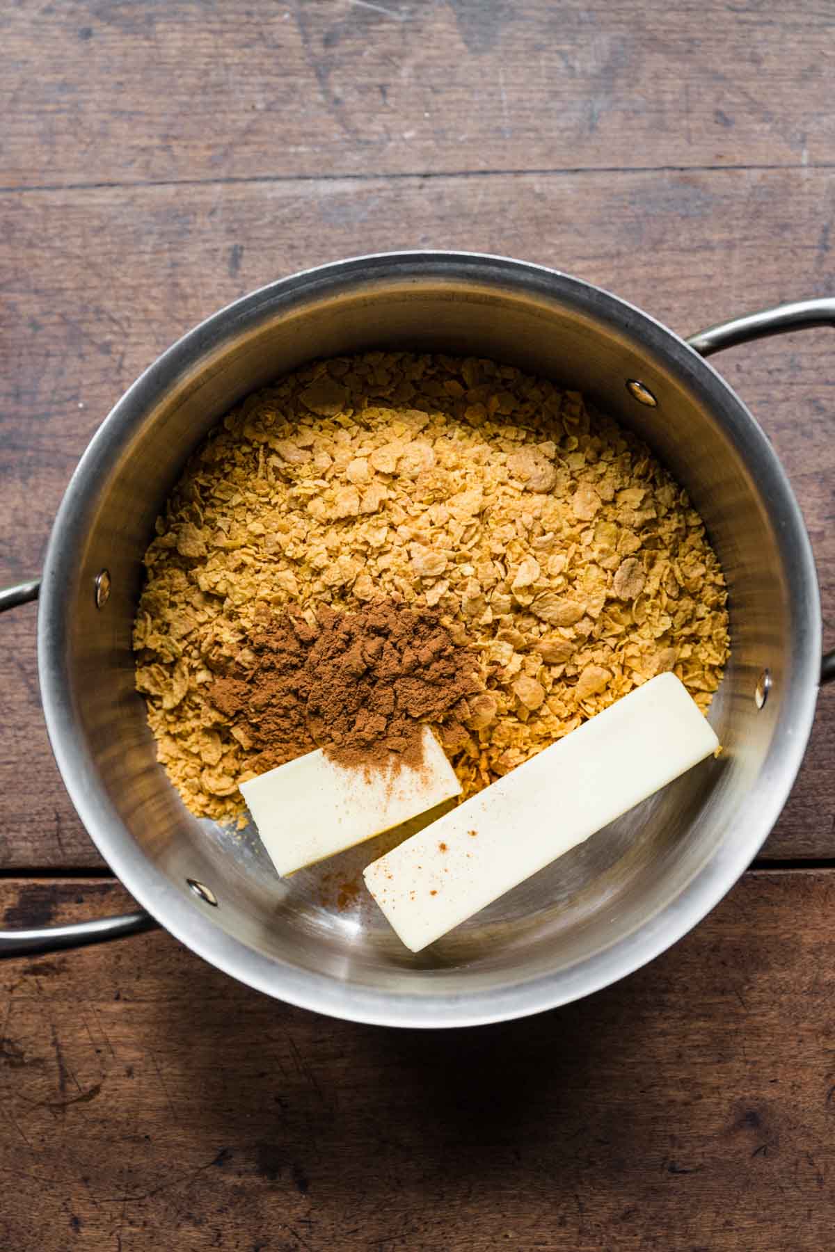 Butter and cornflakes in saucepan for Fried Ice Cream Dessert Casserole