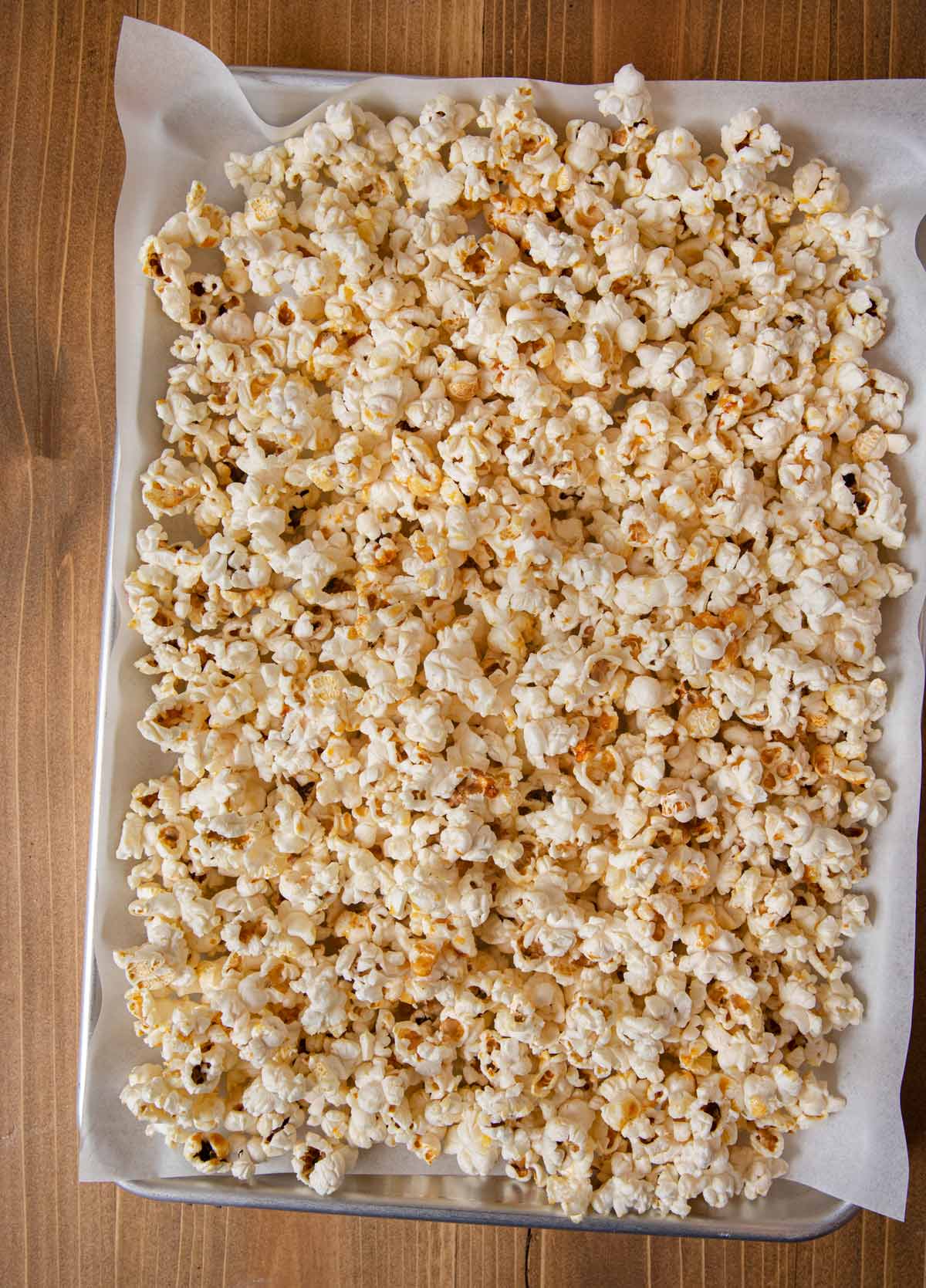 Kettle Corn spread out on baking sheet