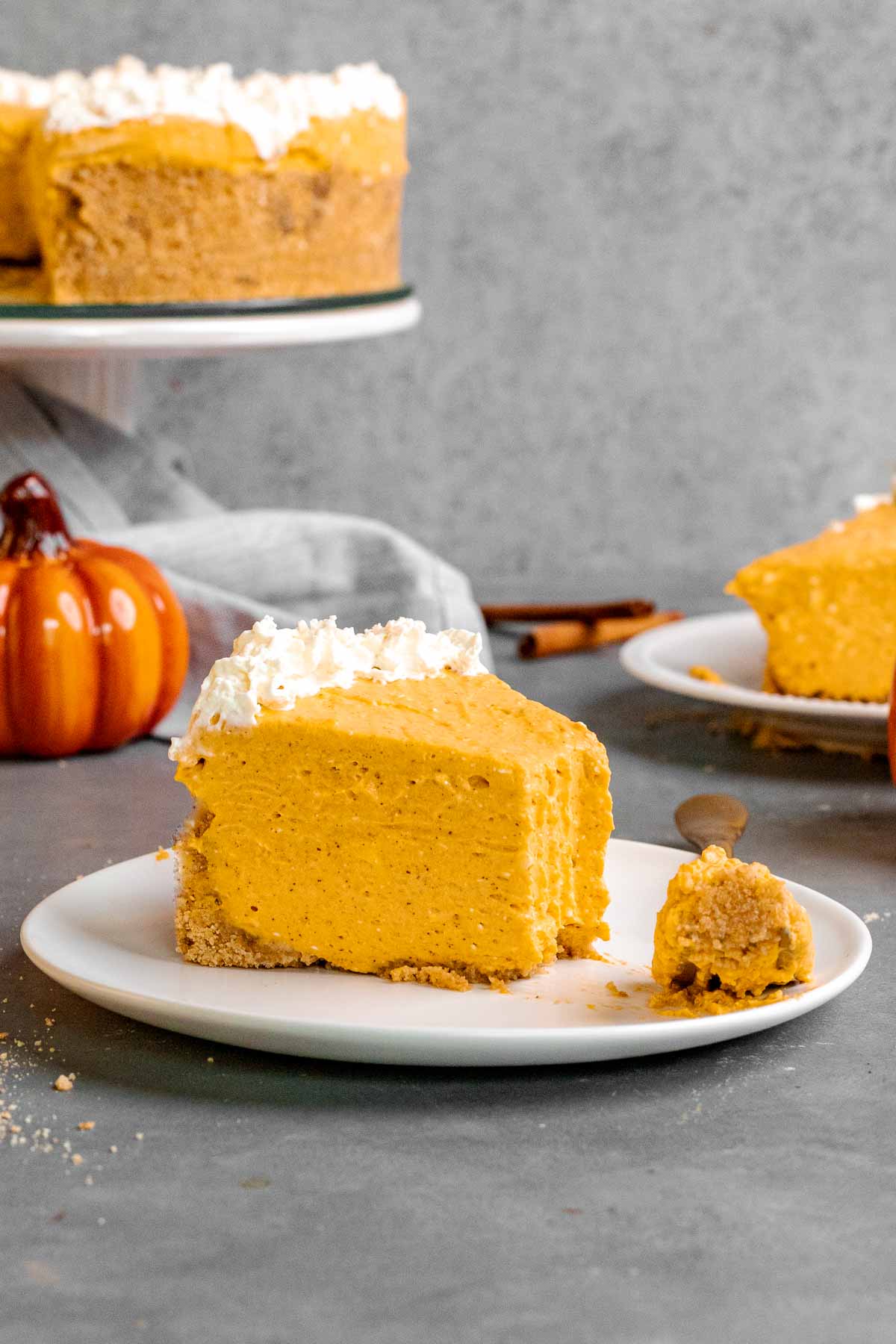Slice of no-bake Pumpkin Cheesecake served on a plate.