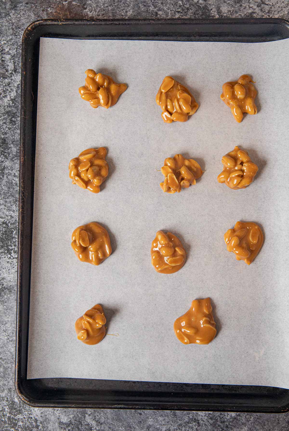 Polar Bear Claws peanuts in caramel clusters on baking sheet