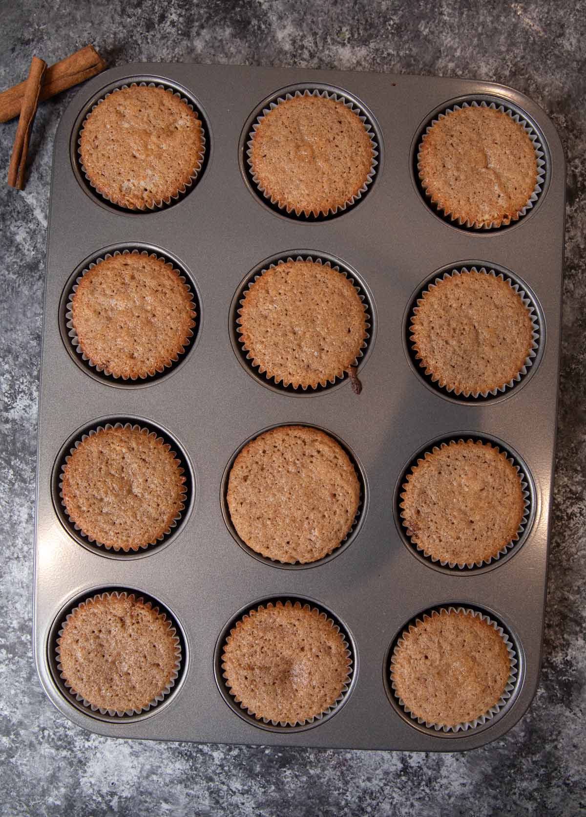 Snickerdoodle Cupcakes in muffin tin