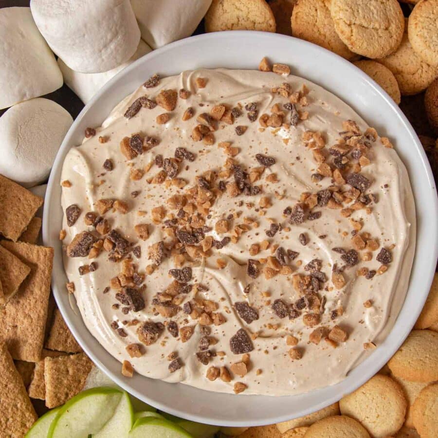 Toffee Apple Dip bowl on tray with foods for dipping