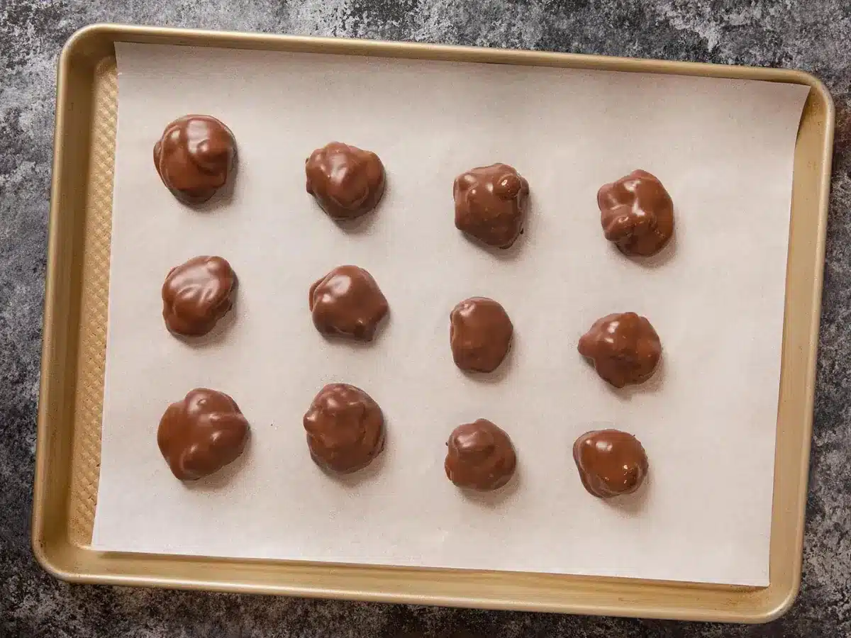 chocolates spread out on cookie sheet