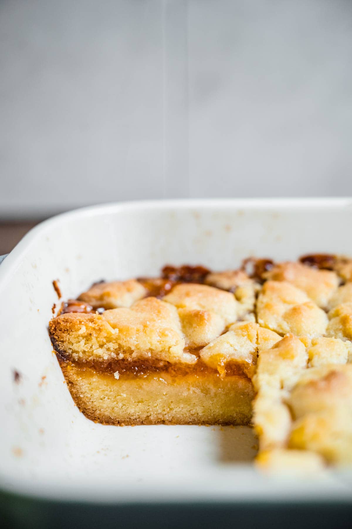 Apricot Shortbread Bars sliced in baking dish