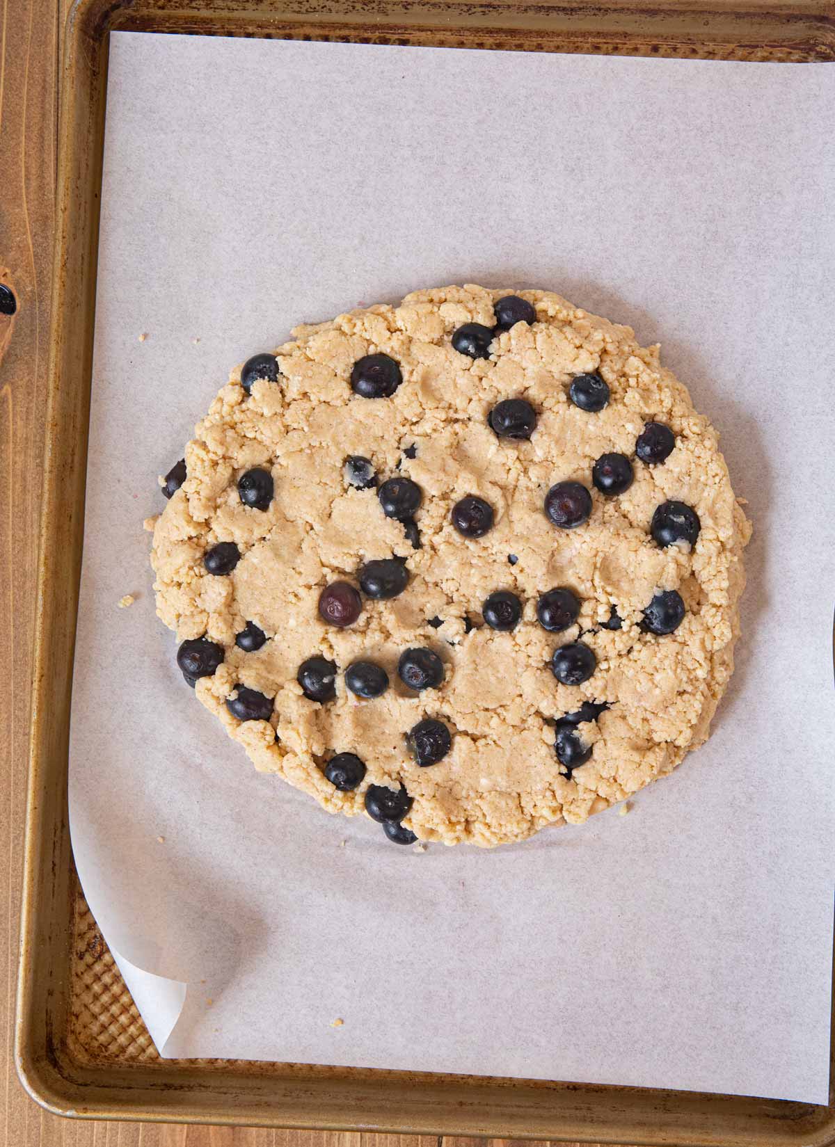 Blueberry Scones dough in flattened circle on cookie sheet