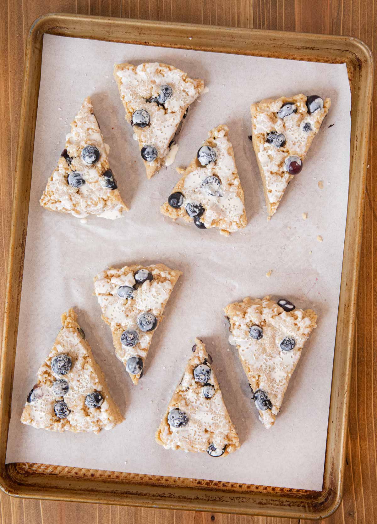 Blueberry Scones unbaked sliced scone wedges on cookie sheet