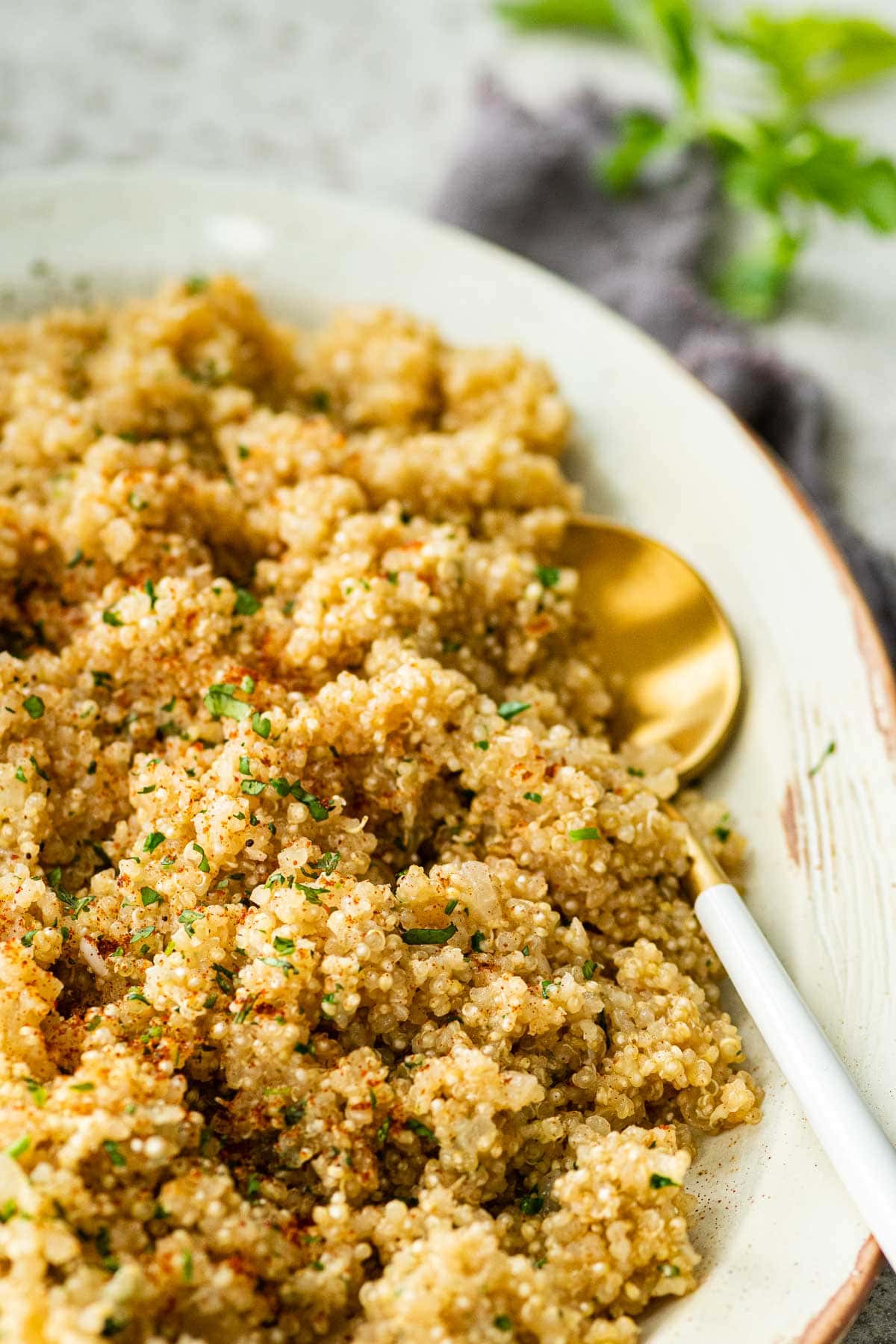 Buttery Garlic Quinoa in serving dish with spoon