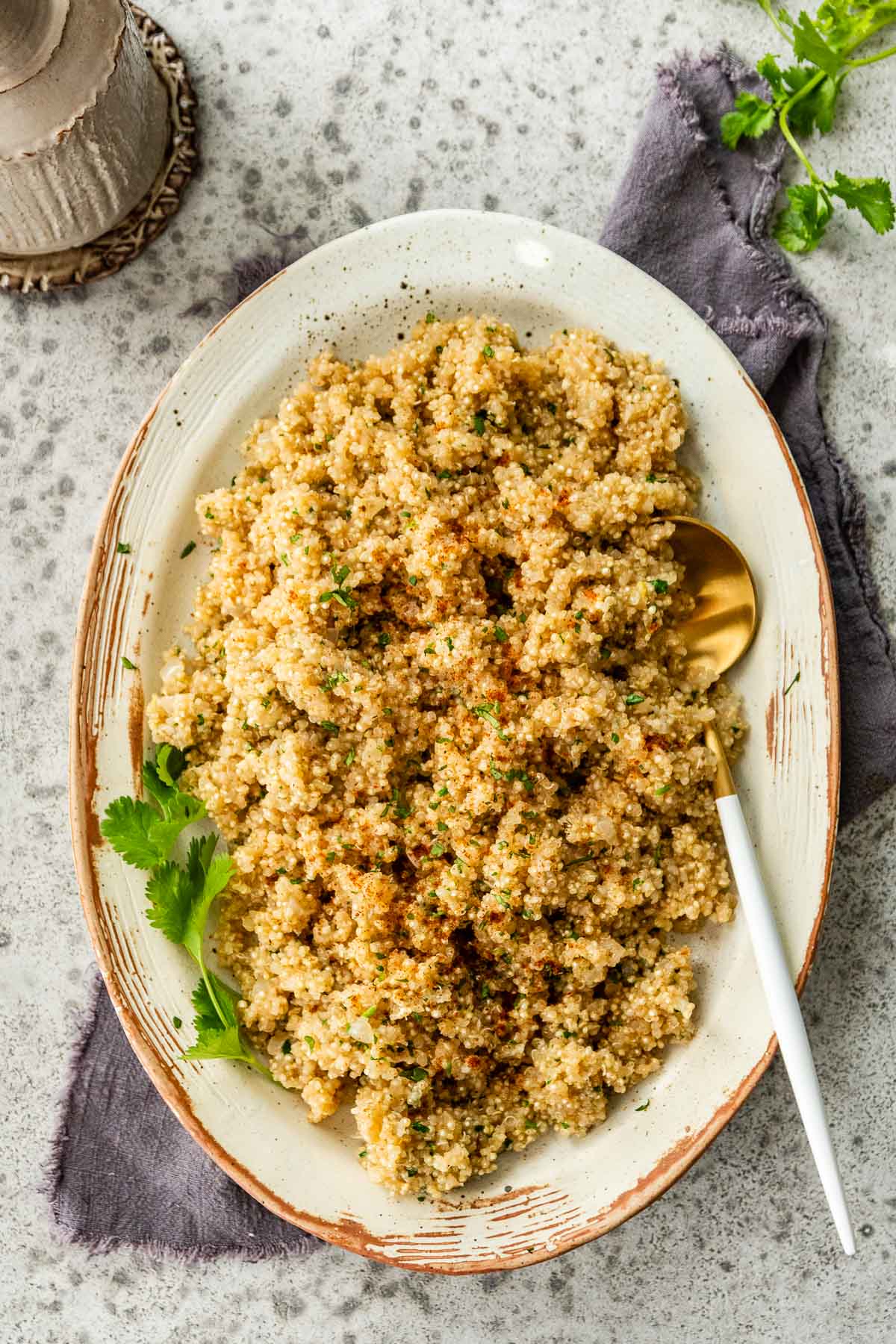 Buttery Garlic Quinoa in serving dish with spoon