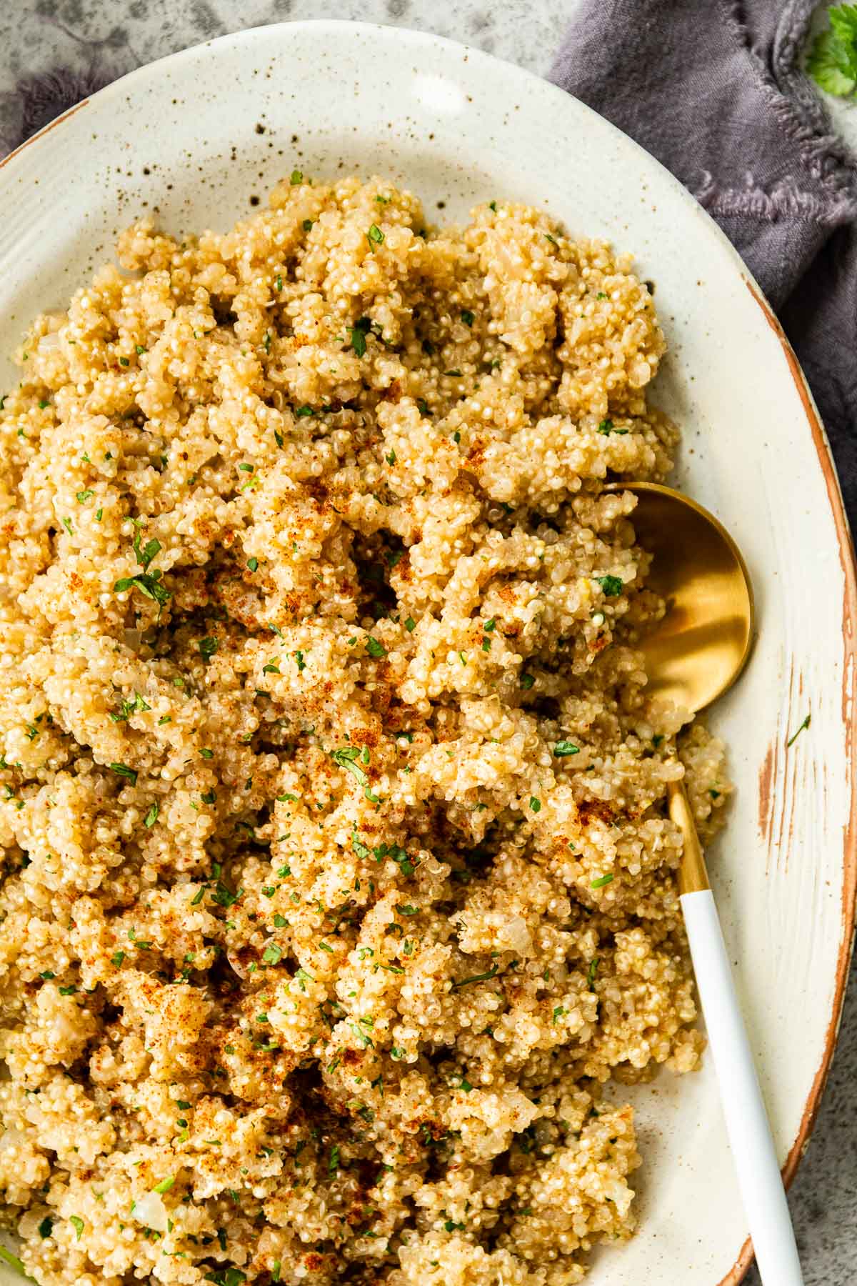 Buttery Garlic Quinoa in serving dish with spoon