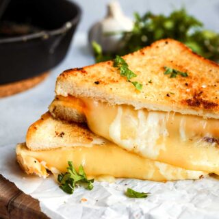 Garlic Butter Four Cheese Grilled Cheese cooked, slices stacked on each other