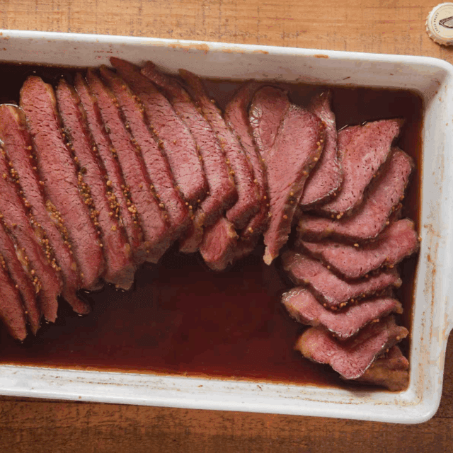 cut cooked meat in pan