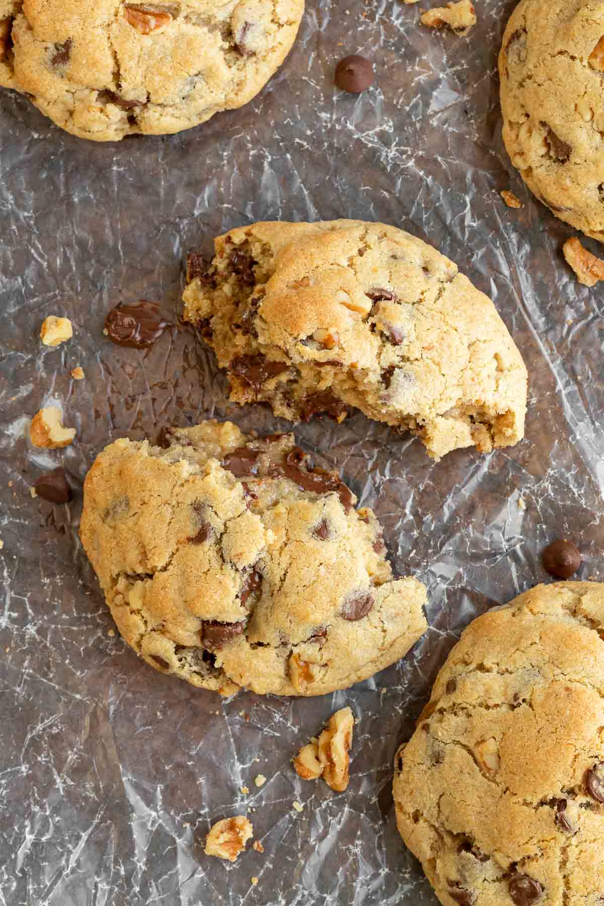 Levain Chocolate Chip Cookies broken in half on baking sheet