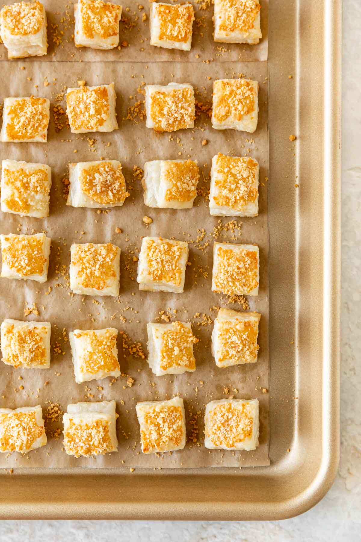 Parmesan Puffs baked on baking sheet close up