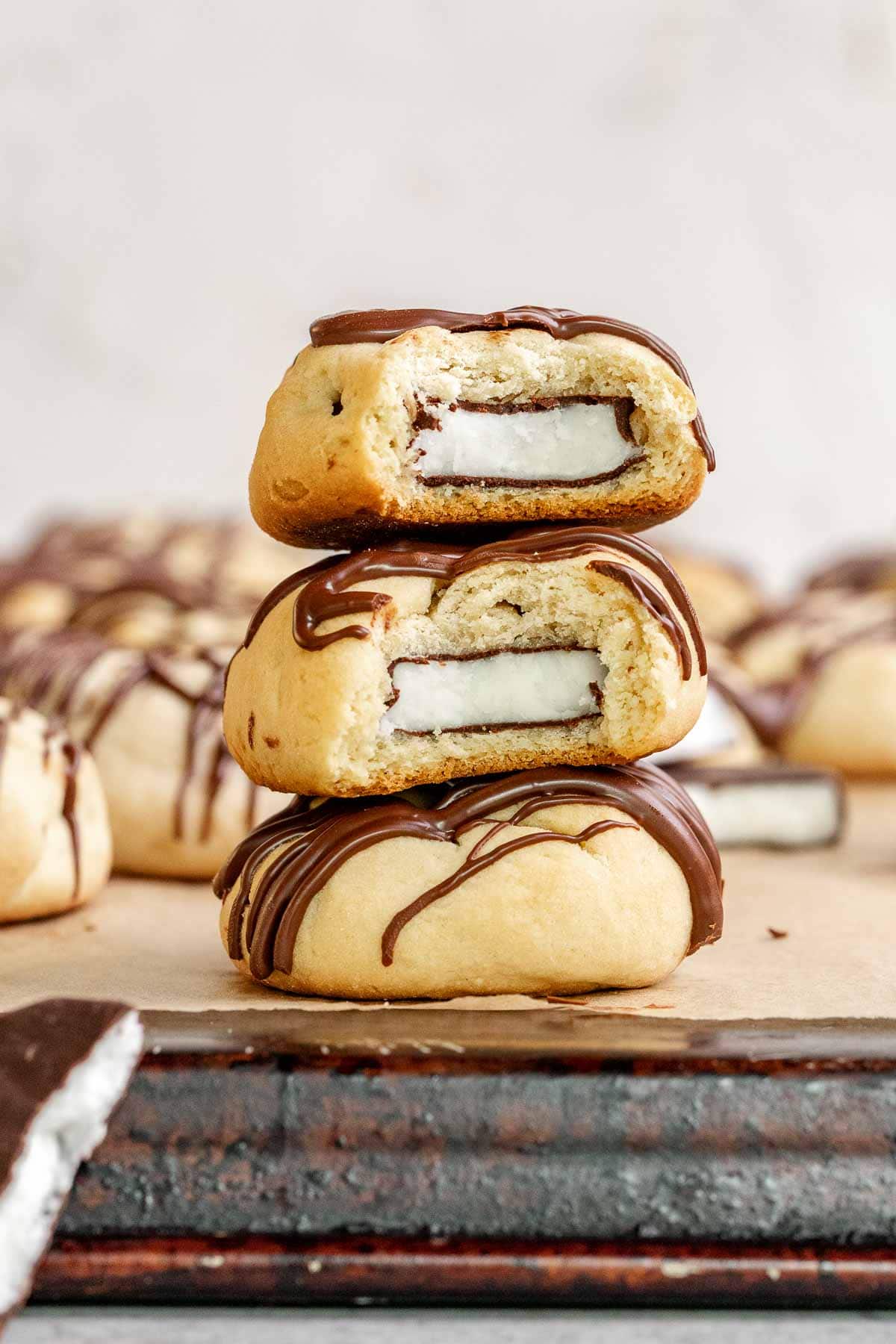 Peppermint Filled Cookies three cookies with bites taken in a stack