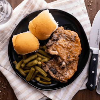 Top view of pork served with sides