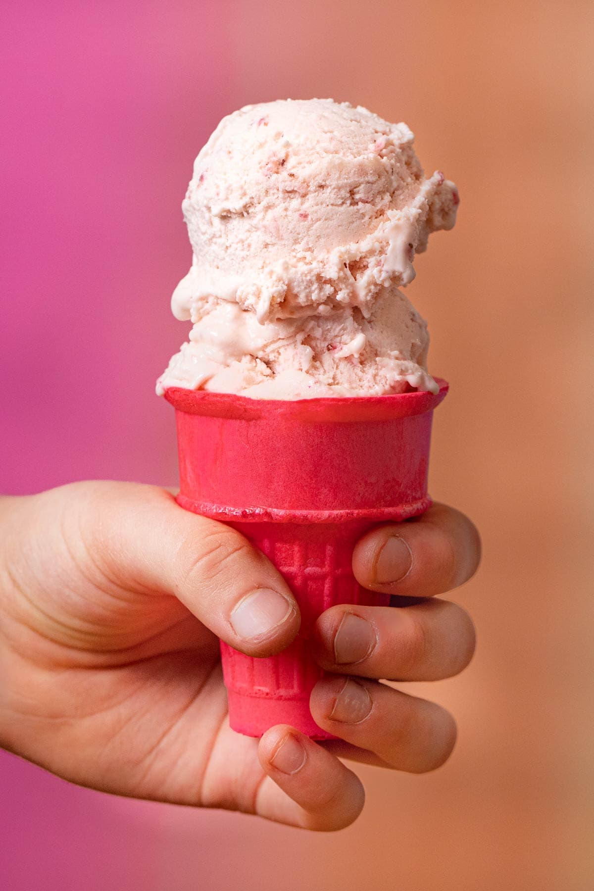 Strawberry Ice Cream scoops on cone