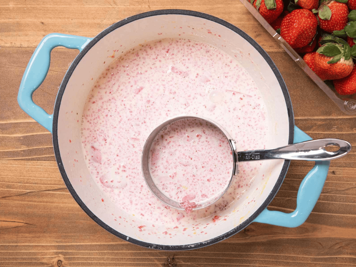Ingredients with fruit mixed in a blue pot