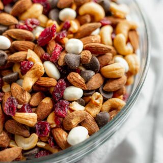 Cranberry Trail Mix in a bowl with Almonds, Cashews, dried cranberries, chocolate chips, and yogurt covered raisins.