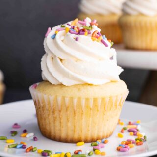 Vanilla Cupcakes on plate with sprinkles