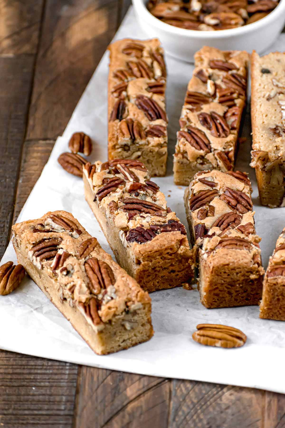 Maple Pecan Bars served on a wooden cutting board.