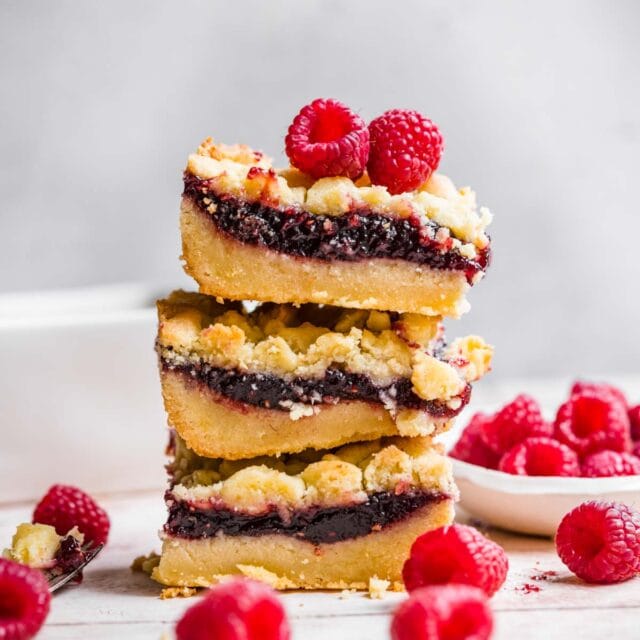 Raspberry Shortbread Bars stack on serving plate 1x1